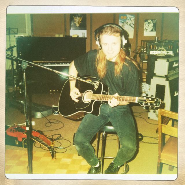 Jorge playing acoustic guitar